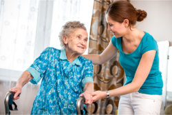 caregiver assisting the elder